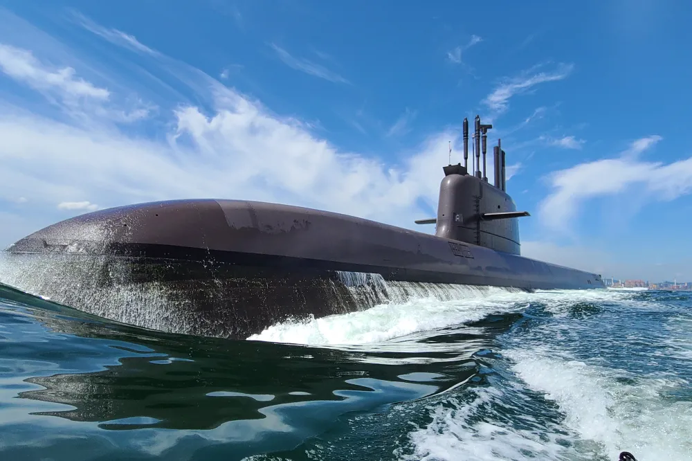 Two KSS-III conventional submarines operating at sea during surface transit
