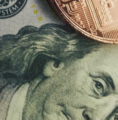 Close-up of U.S. currency with digital asset tokens, illustrating themes of tokenization and modern financial infrastructure