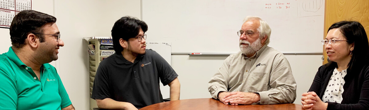 Mark Mason is joined by three of his coworkers at Hanwha Azdel, sitting around a table in the conference room.