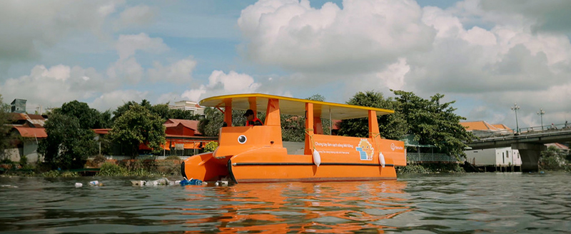 A Hanwha boat uses solar energy to clean up waste in Vietnam's Mekong River