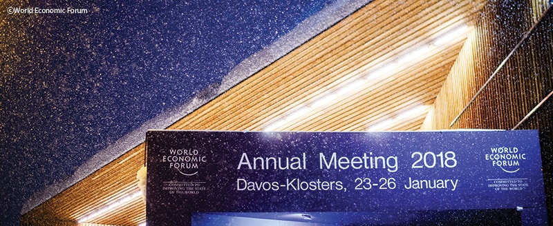A flurry of snow falls upon the Davos Congress Centre, home of the World Economic Forum
