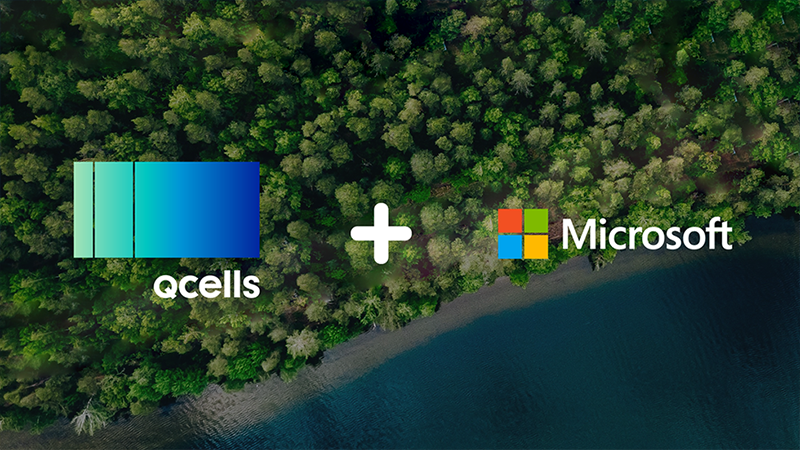 Hanwha Qcells and Microsoft logos set against a forest coastline aerial backdrop featuring green treetops and deep blue water.