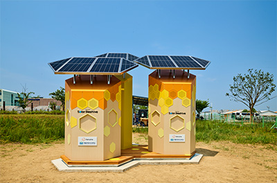 Exterior view of Hanwha's Solar Beehive that creates a safe habitat for bees and monitors their activity using solar power.