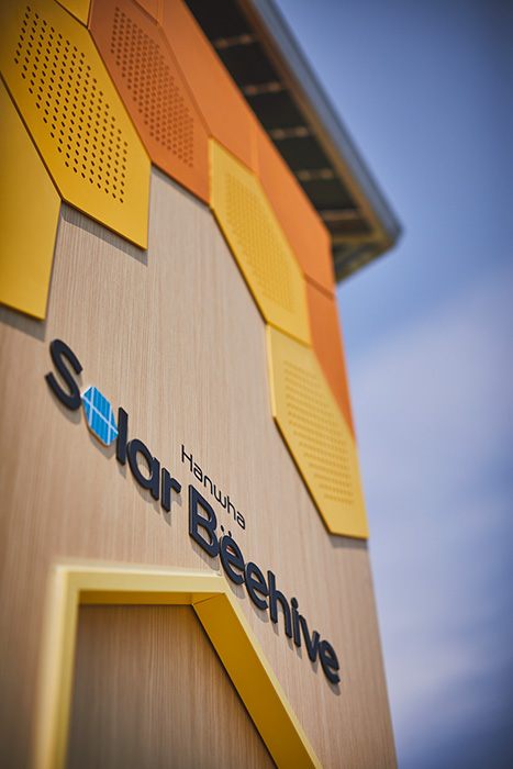 A close-up view of the Hanwha Solar Beehive logo.
