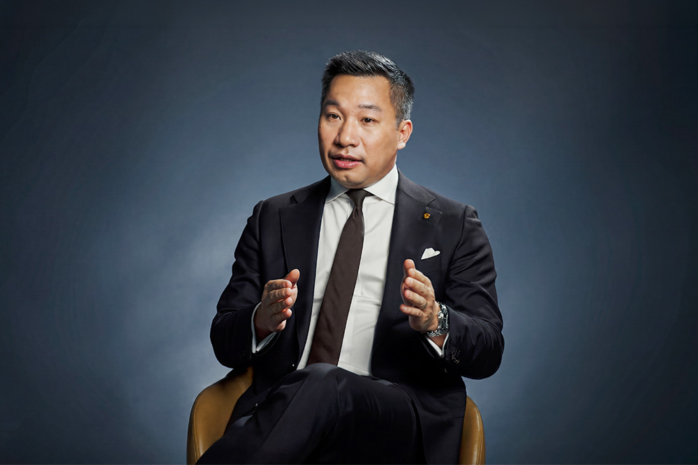 Alex Wong, Hanwha Group Global CSO, speaking during an interview in a studio setting.