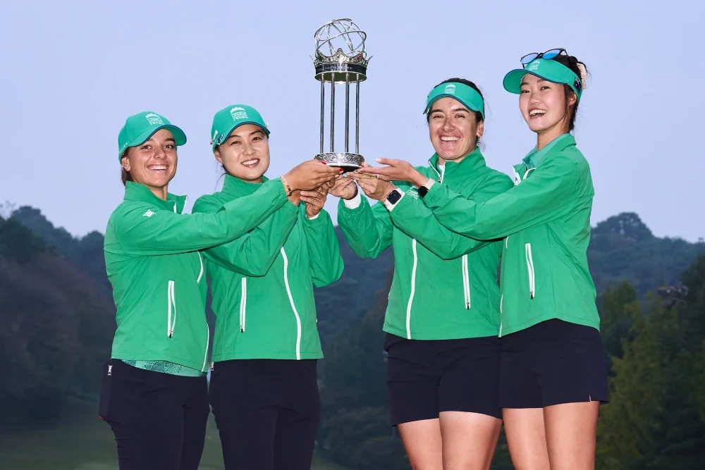 The Australian team celebrates victory, holding the tournament trophy.