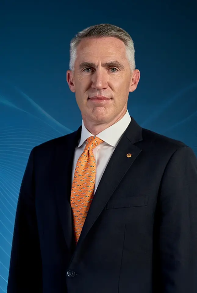 Michael Coulter pictured against a blue background.
