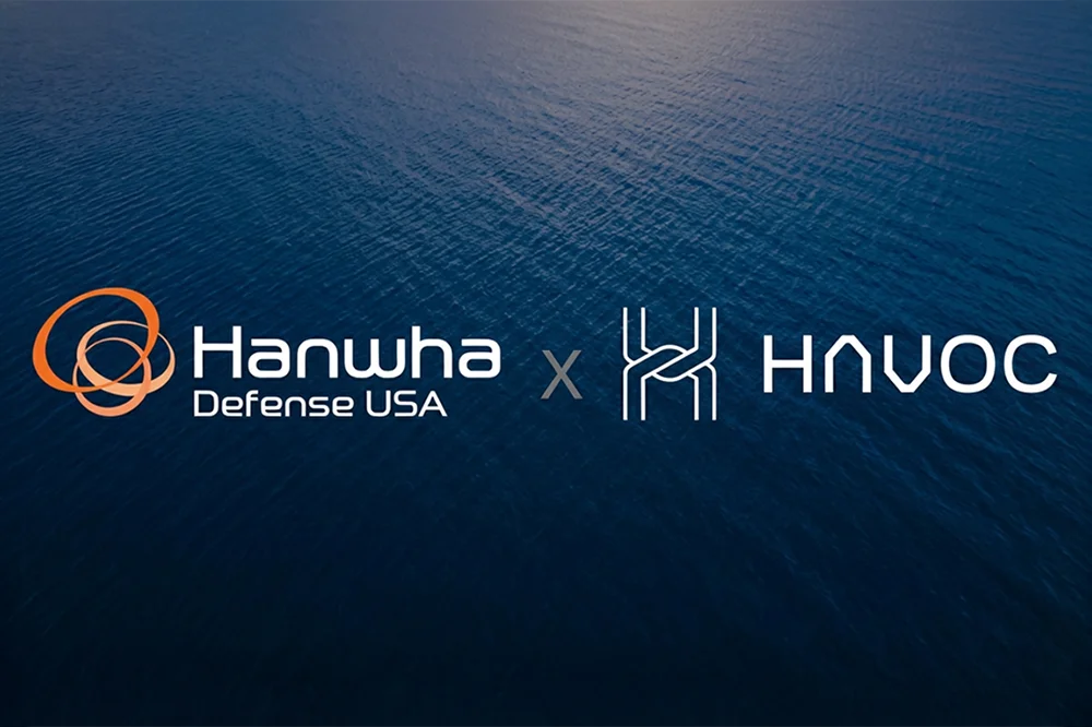 Hanwha Defense USA and HavocAI logos displayed on an ocean background.