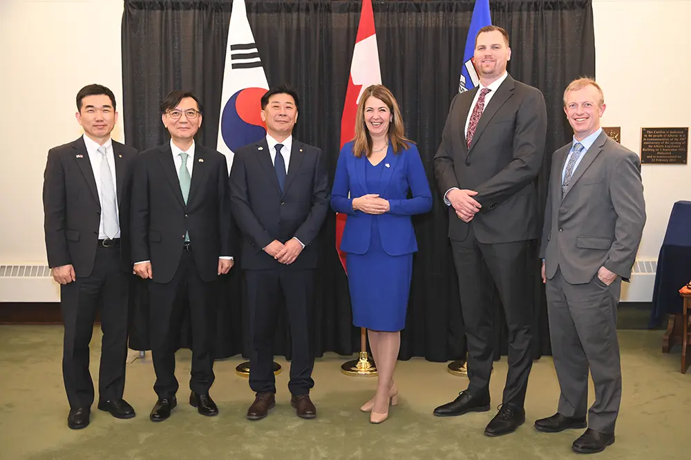 Hanwha Energy executives and Alberta government officials pose for a photo after signing an MOU