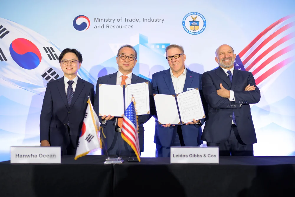 JK (Jung-Kwan) Kim, Insub Jung,  Mike Rickels, and Howard Lutnick pose after signing an MOU