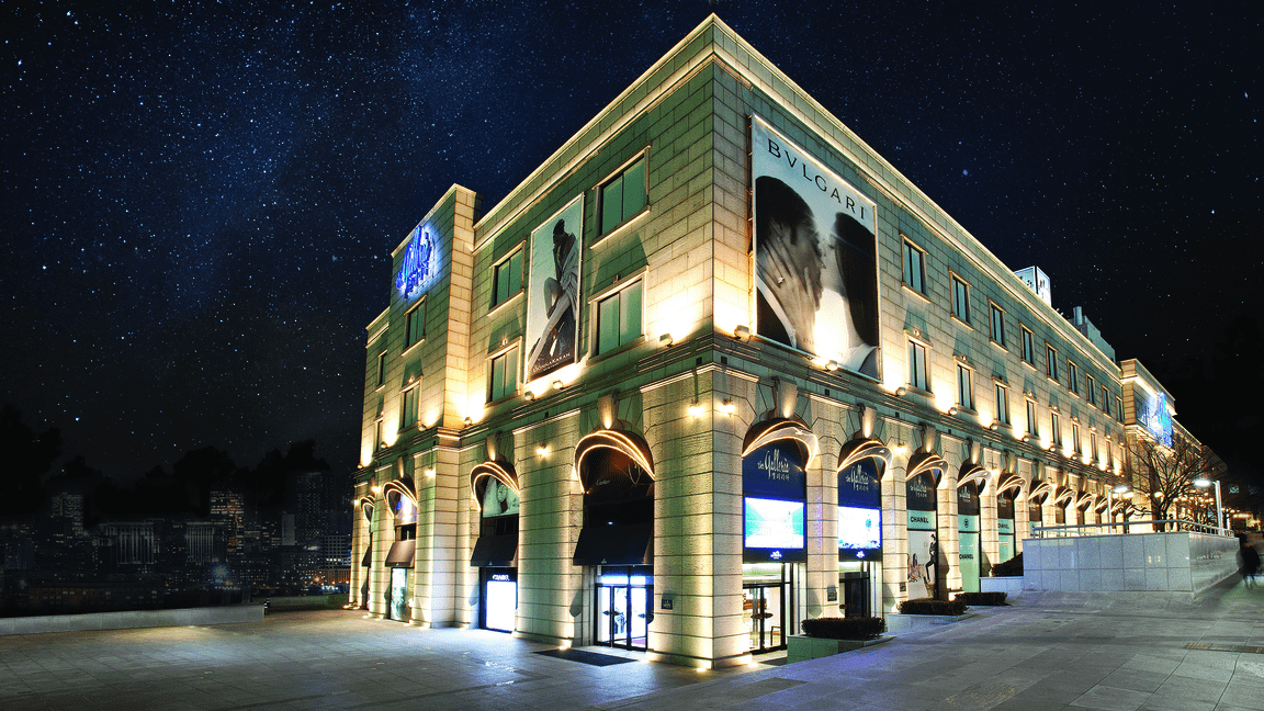 A Hanwha Galleria Luxury Hall, seen from outside at night