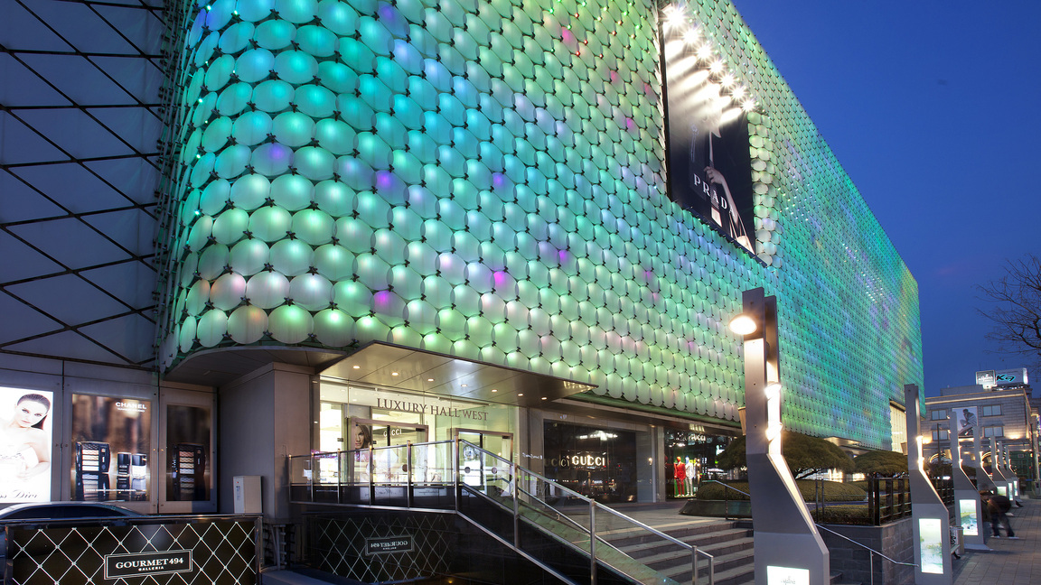 A Hanwha Galleria Luxury Hall, seen from outside at night