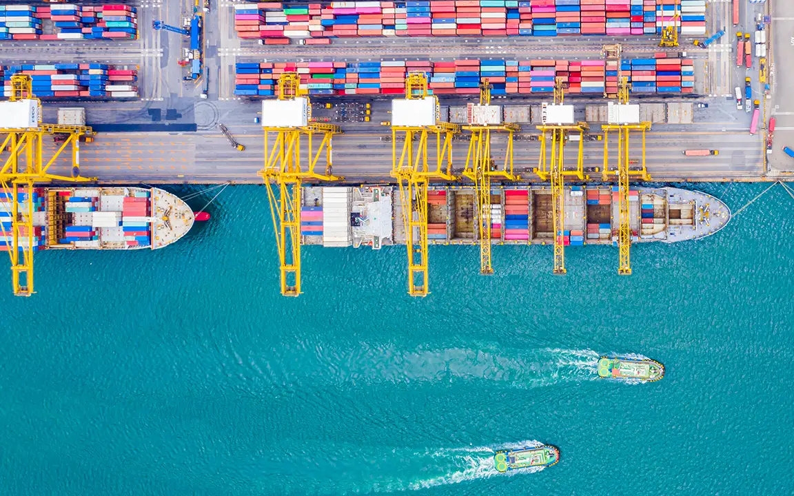 Bird’s eye view of commercial vessels docked at a port