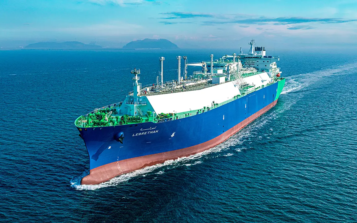 A Hanwha-built LNG carrier at sea under a blue sky