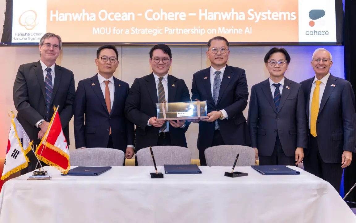 Executives from Hanwha Ocean, Cohere, and Hanwha Systems mark the signing of an MOU on marine AI collaboration
