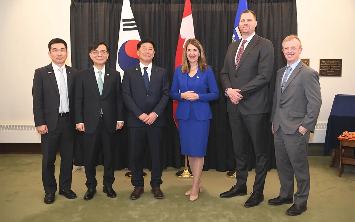 Hanwha Energy executives and Alberta government officials pose for a photo after signing an MOU